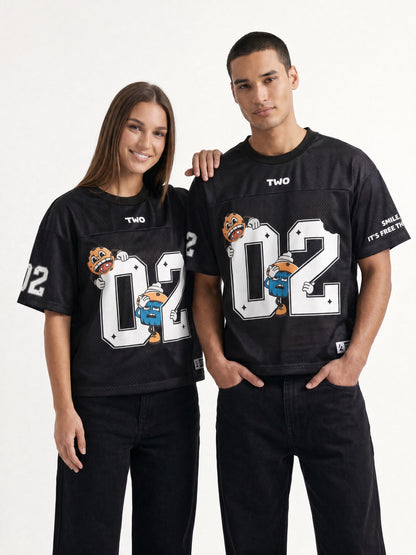 Two Crumbs mesh jersey tee in black — couple wearing oversized 02 mesh jersey, half-body smile