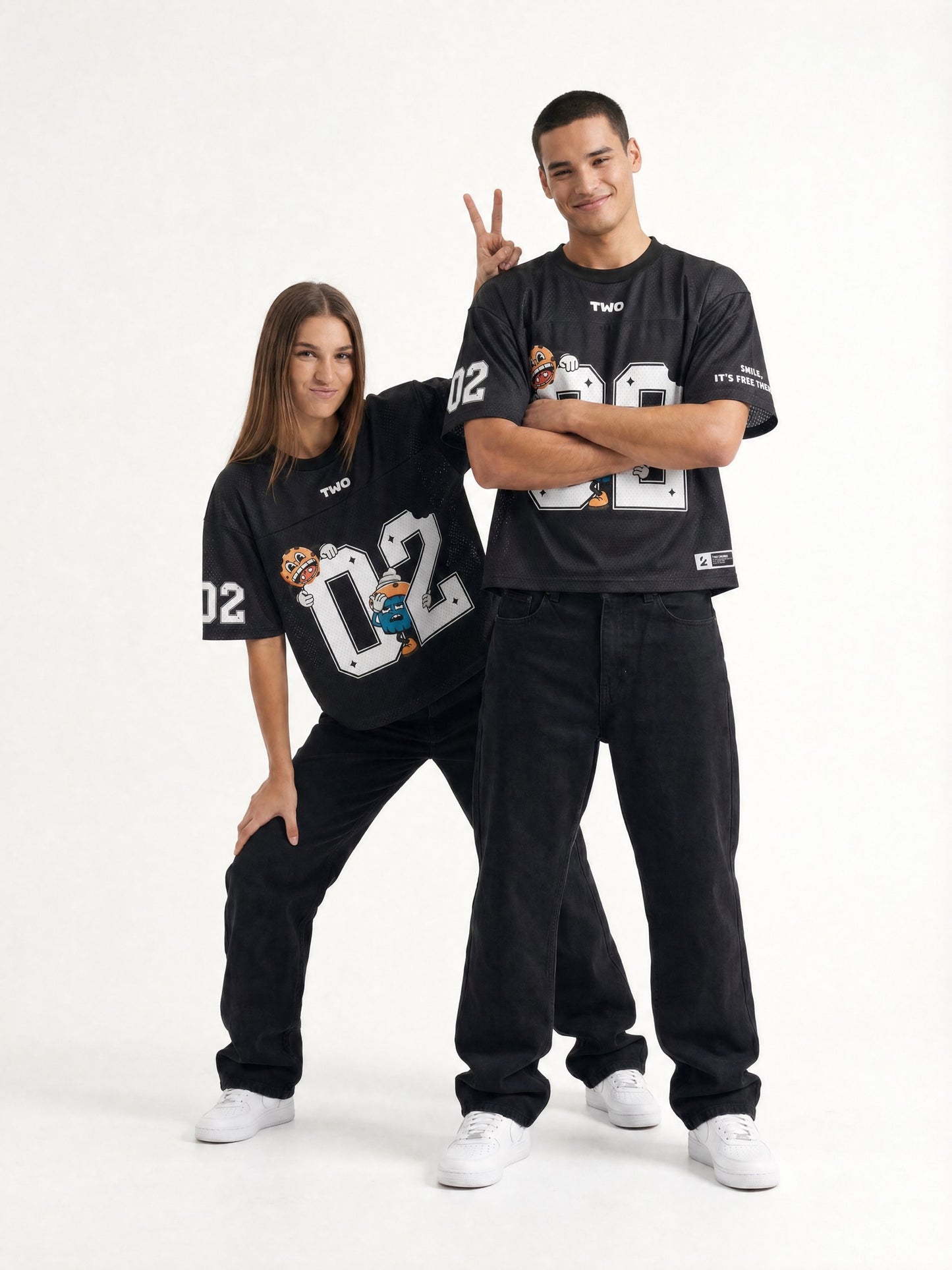 Two Crumbs mesh jersey tee in black — lifestyle shot, oversized streetwear fit on couple