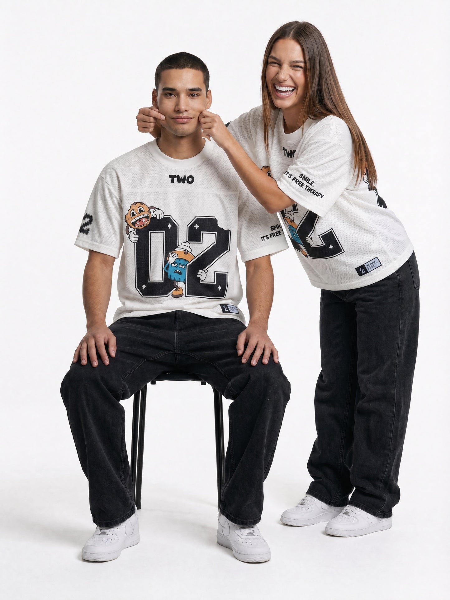 Two Crumbs mesh jersey tee in white — lifestyle shot, oversized streetwear fit on couple